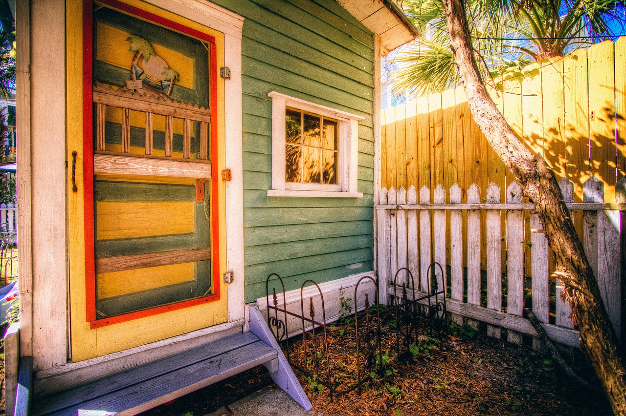 House front porch with columns and outdoor seating
